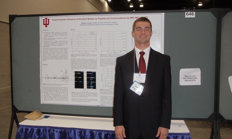 Matt Glover presenting during a poster session. (Click for high resolution original) Matthew Glover presenting during a poster session.