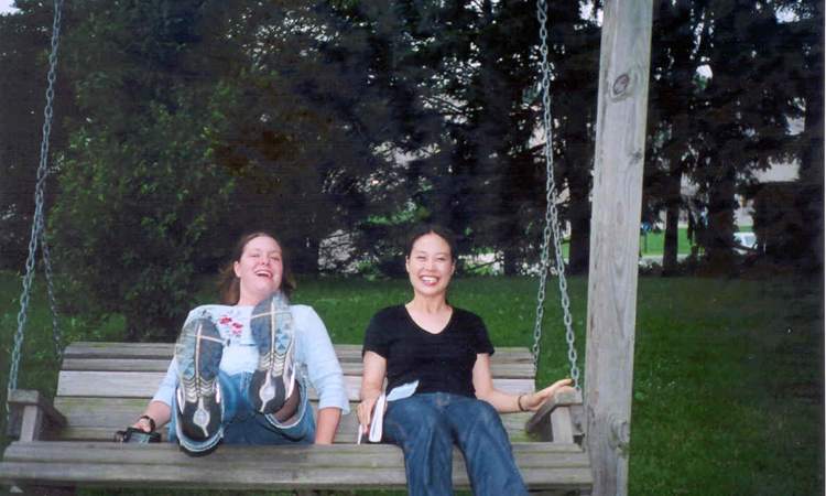 A relaxing swing. Stormy and Sunnie find a wooden swing.